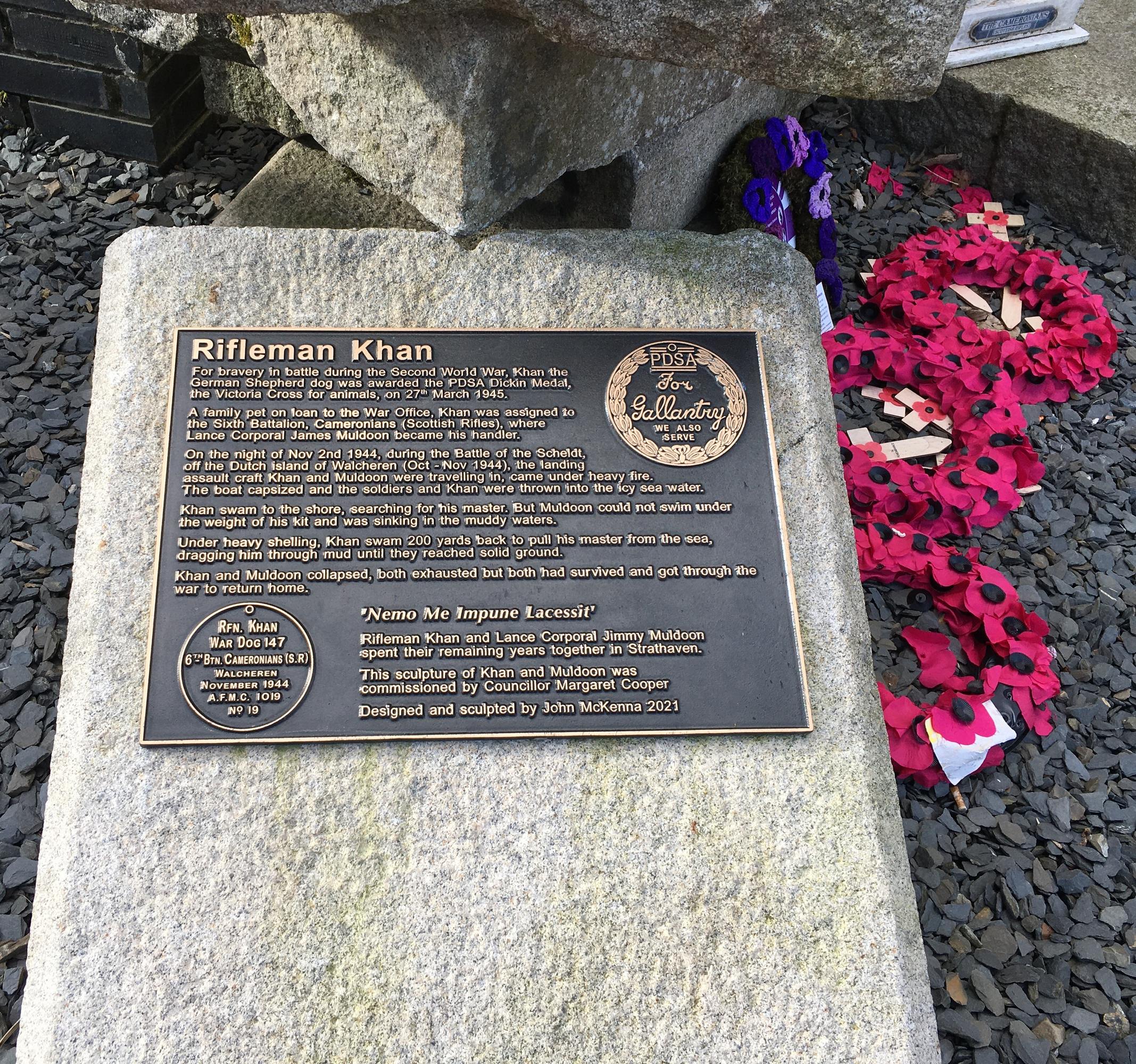  plaque on bronze statue of Khan, a German Shepherd, and L/Cpl Jimmy Muldoon